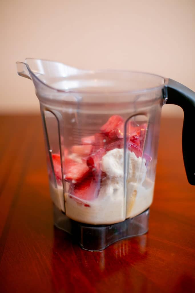 Blender of strawberries and ice cream