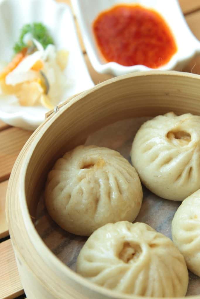 Chicken bao cooked in a bamboo steamer