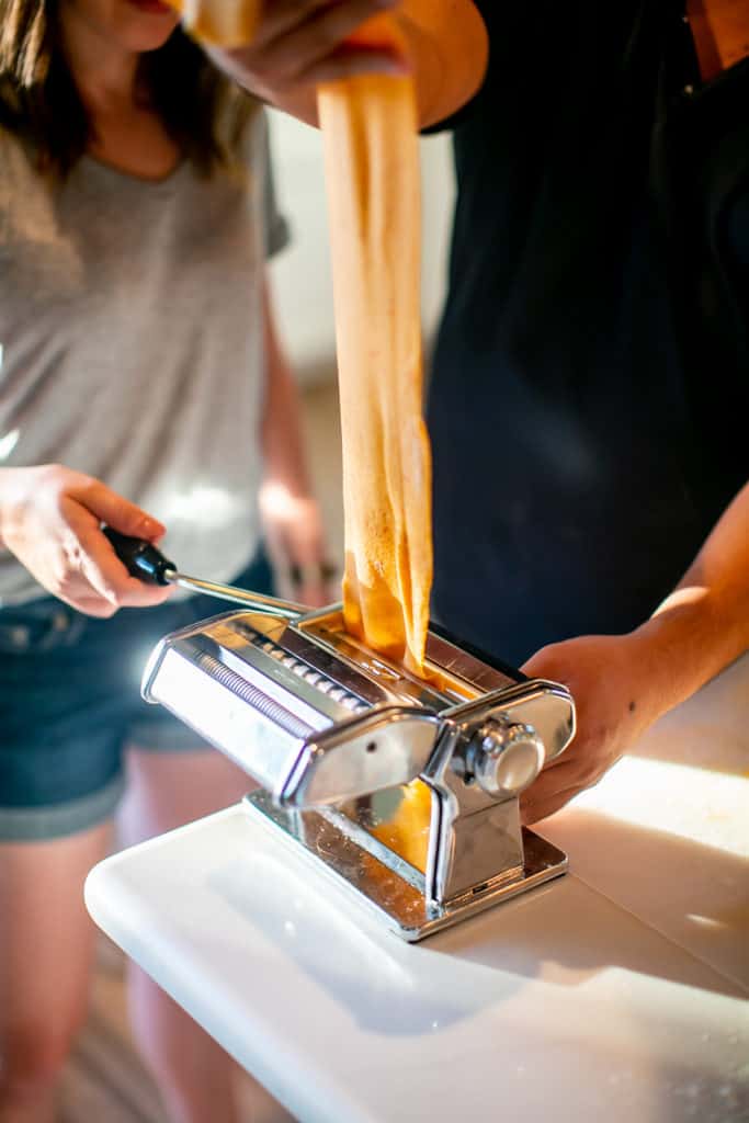 Pasta dough going through the pasta maker on setting 3