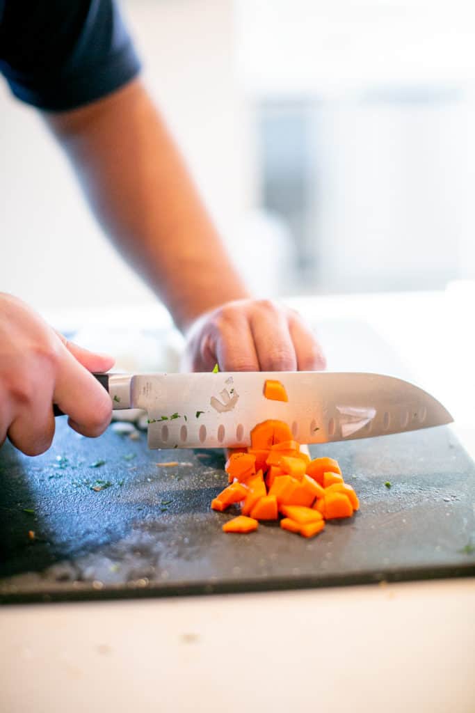 Dicing carrots for beef bolognese recipe