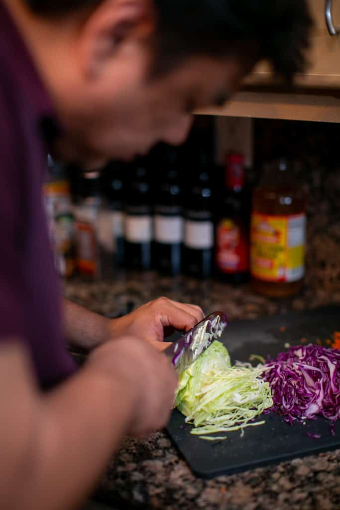 Cutting the cabbage into paper thin slices