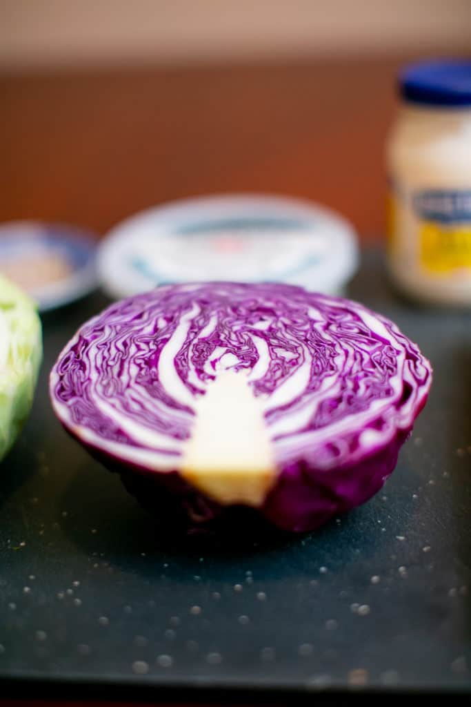 Red cabbage on a black cutting board