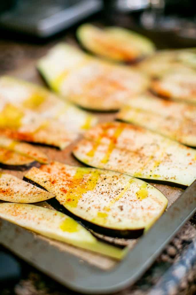 Aubergine eggplants thinly sliced and seasoned with paprika and olive oil