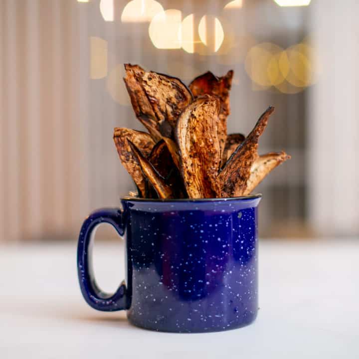 Crispy eggplant chips served in a mug