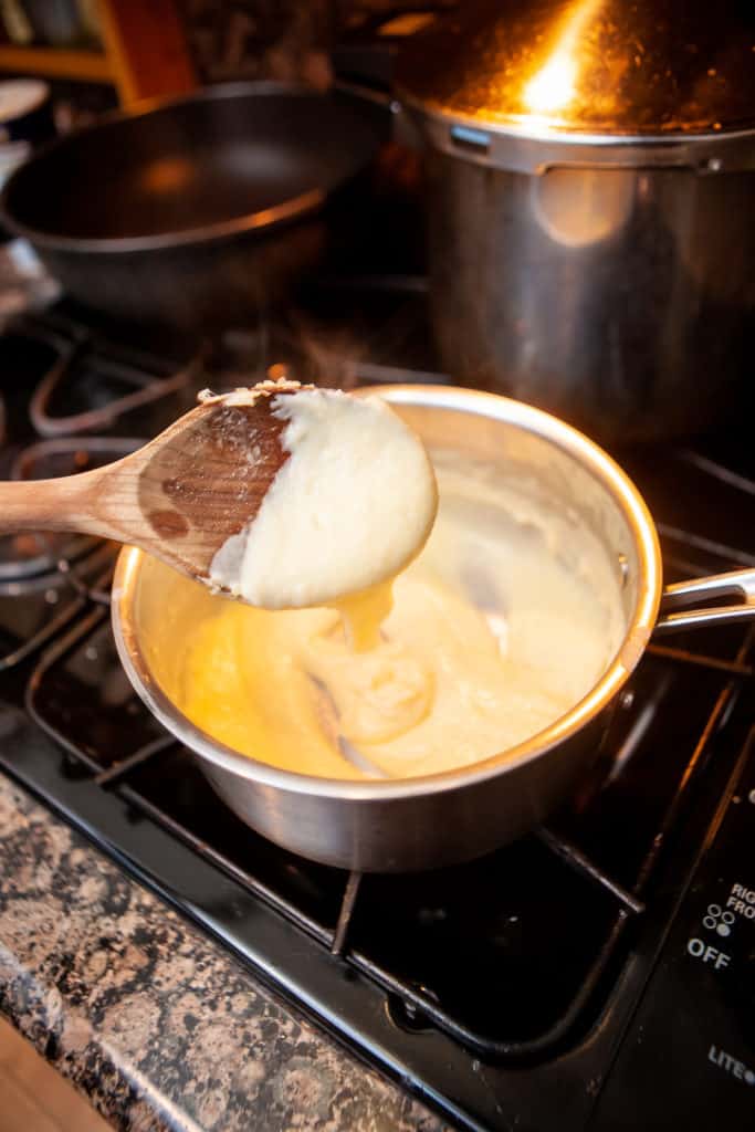 Preparing a bechamel sauce on a stovetop