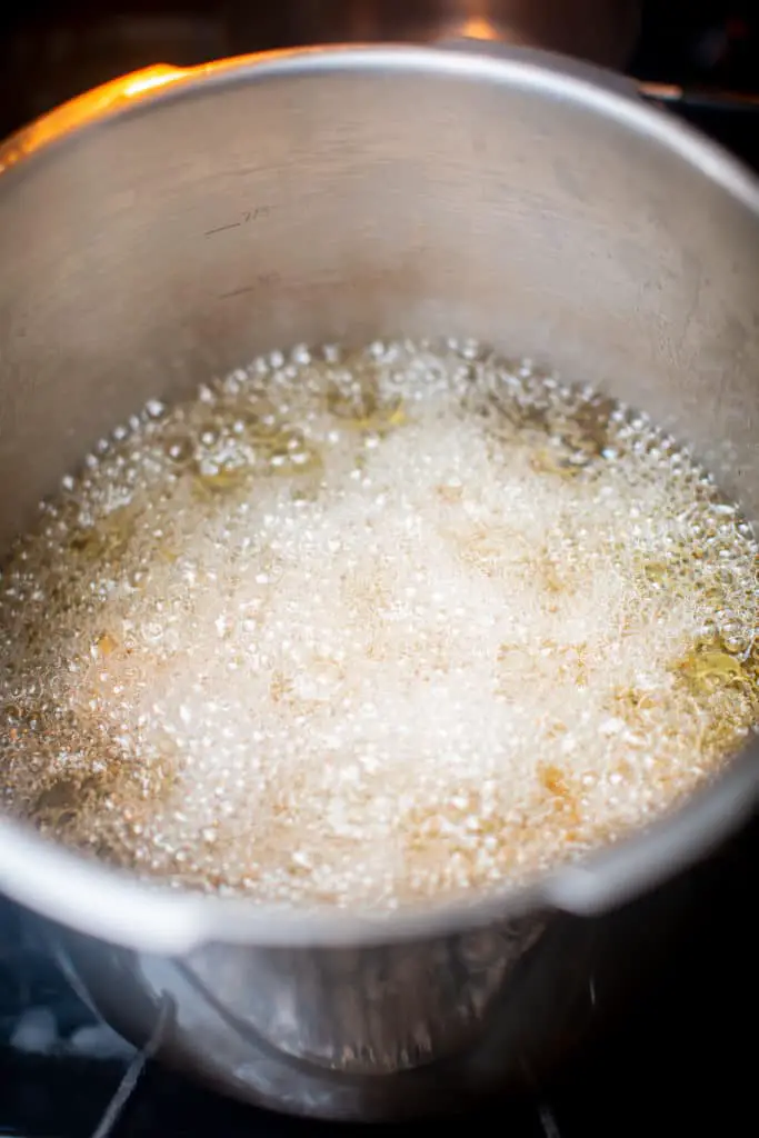 Heating cooking oil to a boil for deep frying