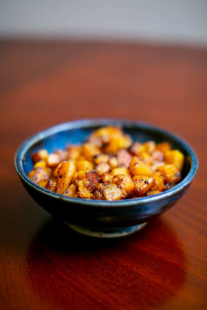 Close photo of roasted butternut squash served on a bowl