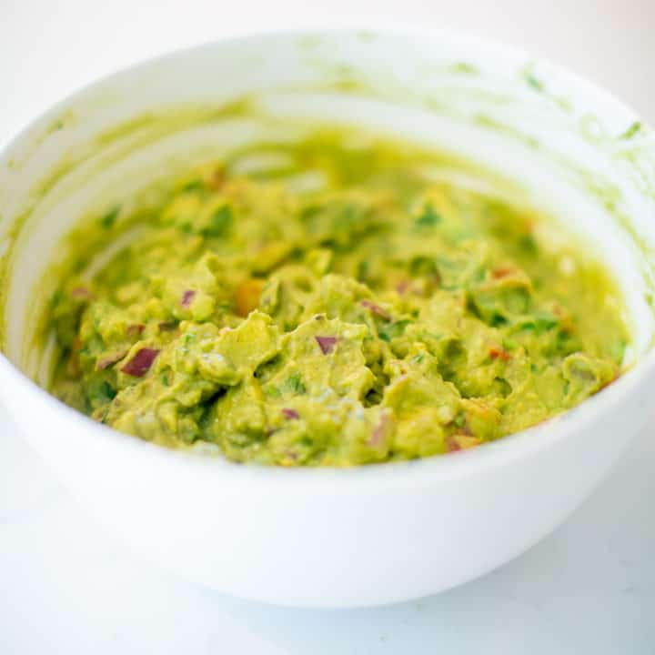Close up of spicy guacamole served on a bowl