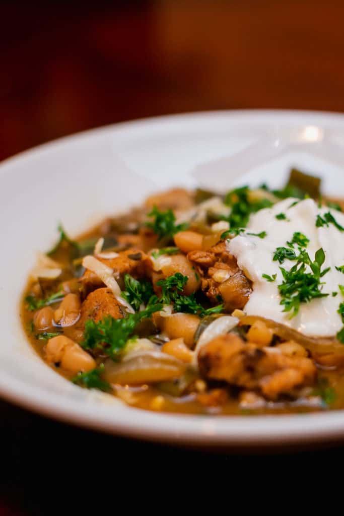 White bean chicken chili recipe served in a white bowl