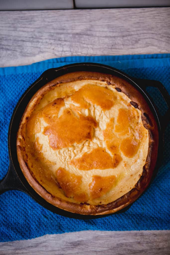 Freshly baked dutch baby in a cast iron skillet