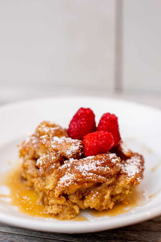 Churro bread pudding topped with raspberries