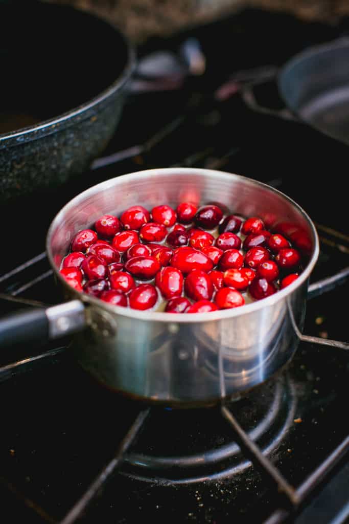 Cranberry sauce getting cooked in a pan