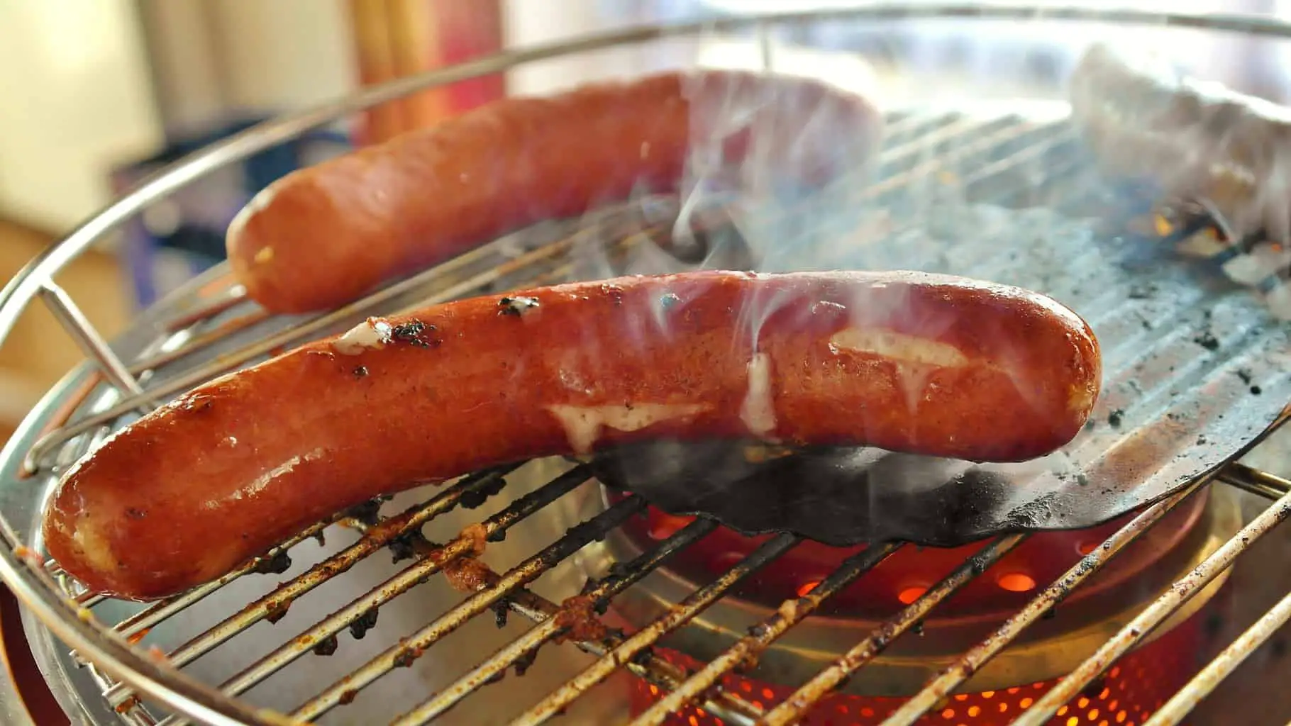 Bratwurst sausages on a grill
