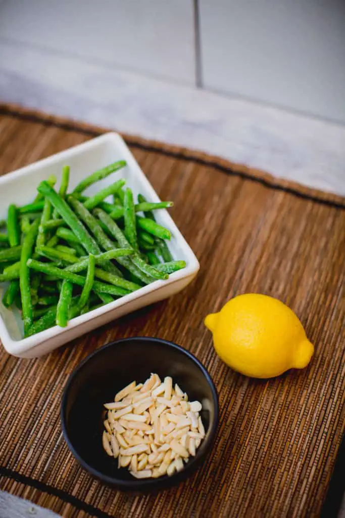Green beans lemon and nuts are ingredients for a simple green bean salad recipe