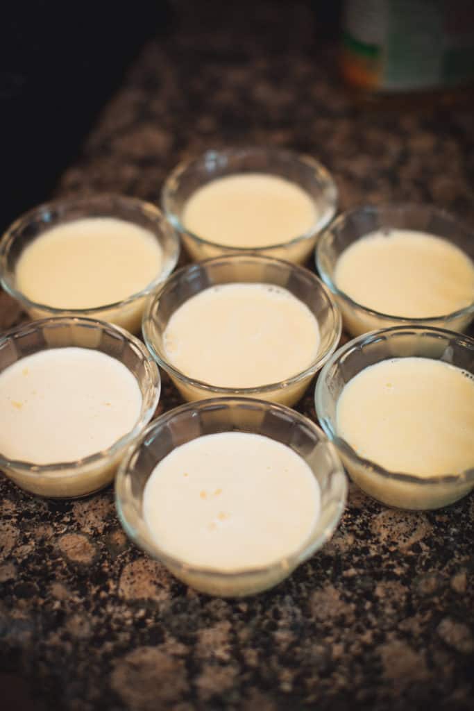 Cups with eggnog panna cotta ready to be filled with their final toppings