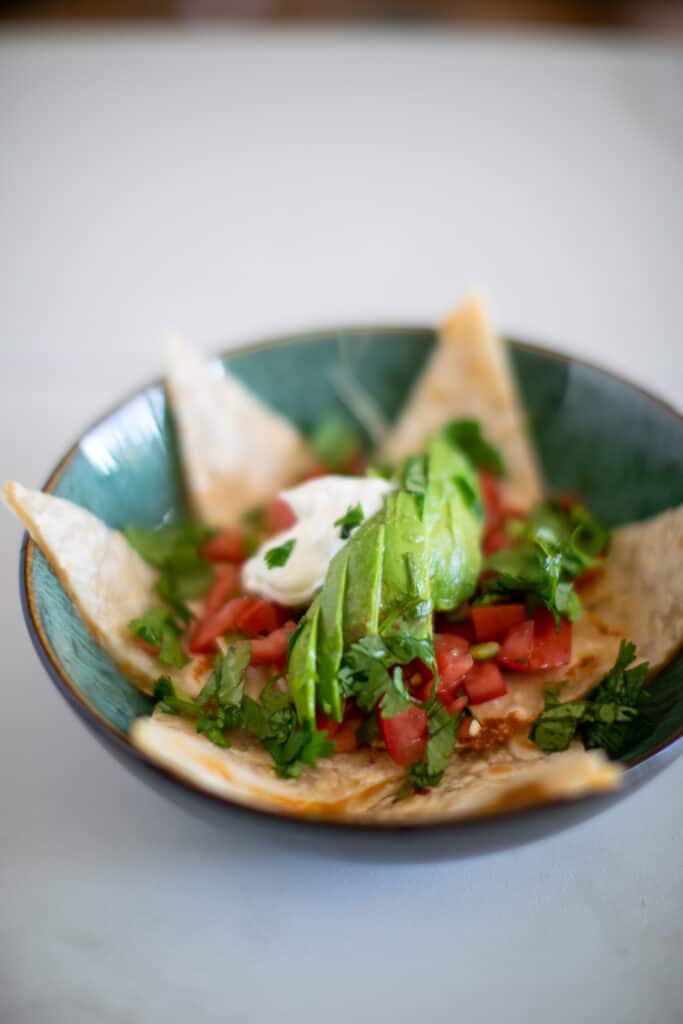 Avocado on top of a bowl of classic cheese quesadilla recipe