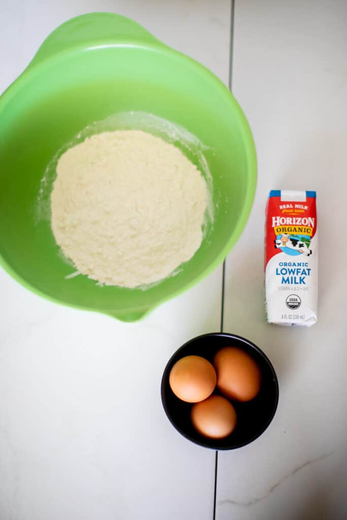 Flour, milk and eggs in a table