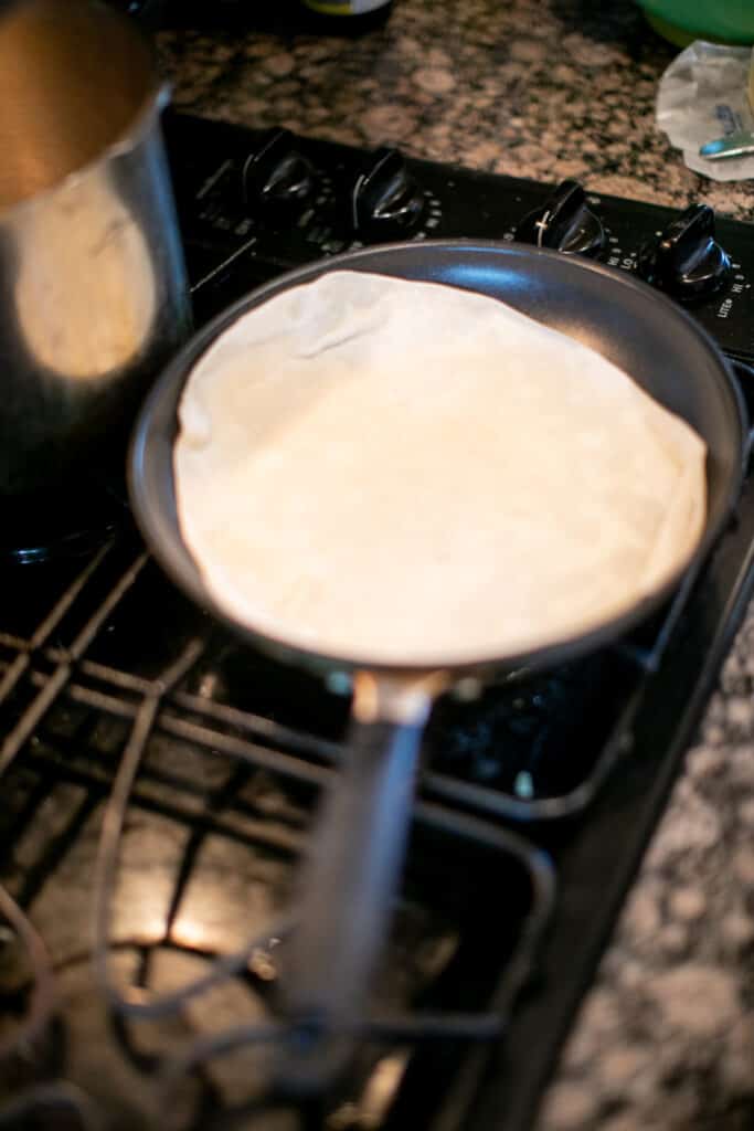 Tortilla being cooked in a pan