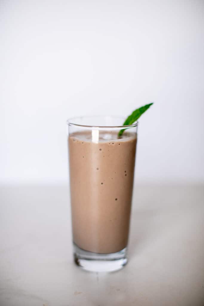 Glass of chocolate peanut butter banana smoothie