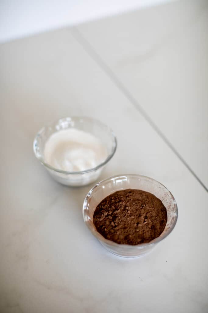 Cocoa powder and white sugar in separate bowls