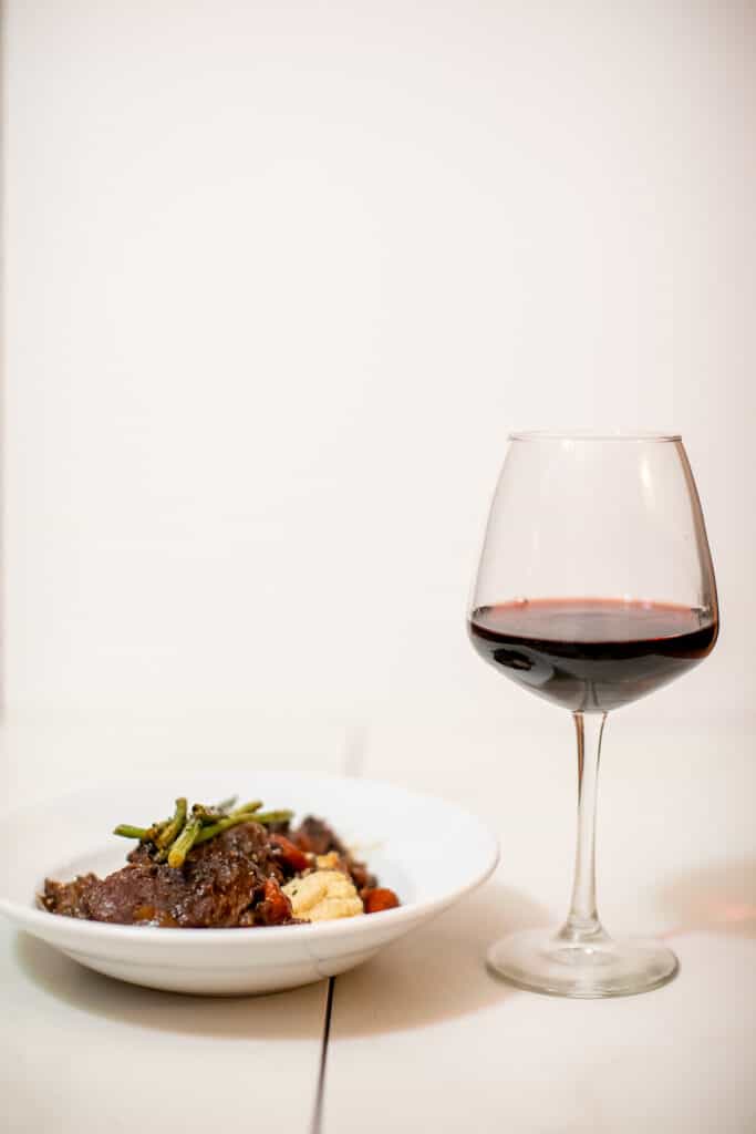 Pot roast paired with a glass of wine