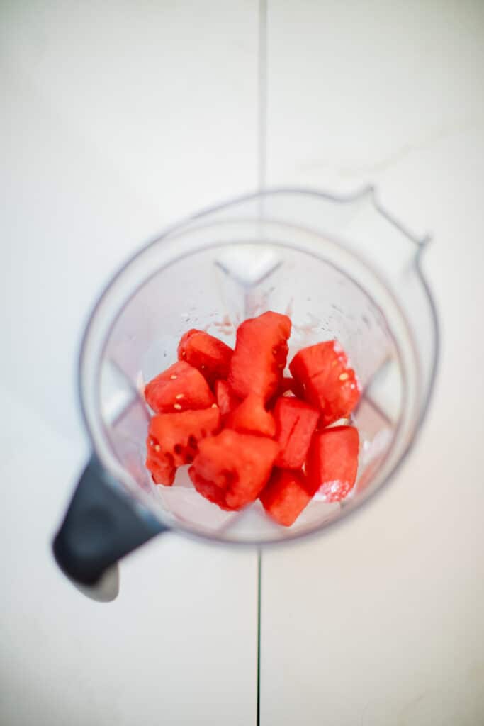 Sliced frozen watermelons in a blender