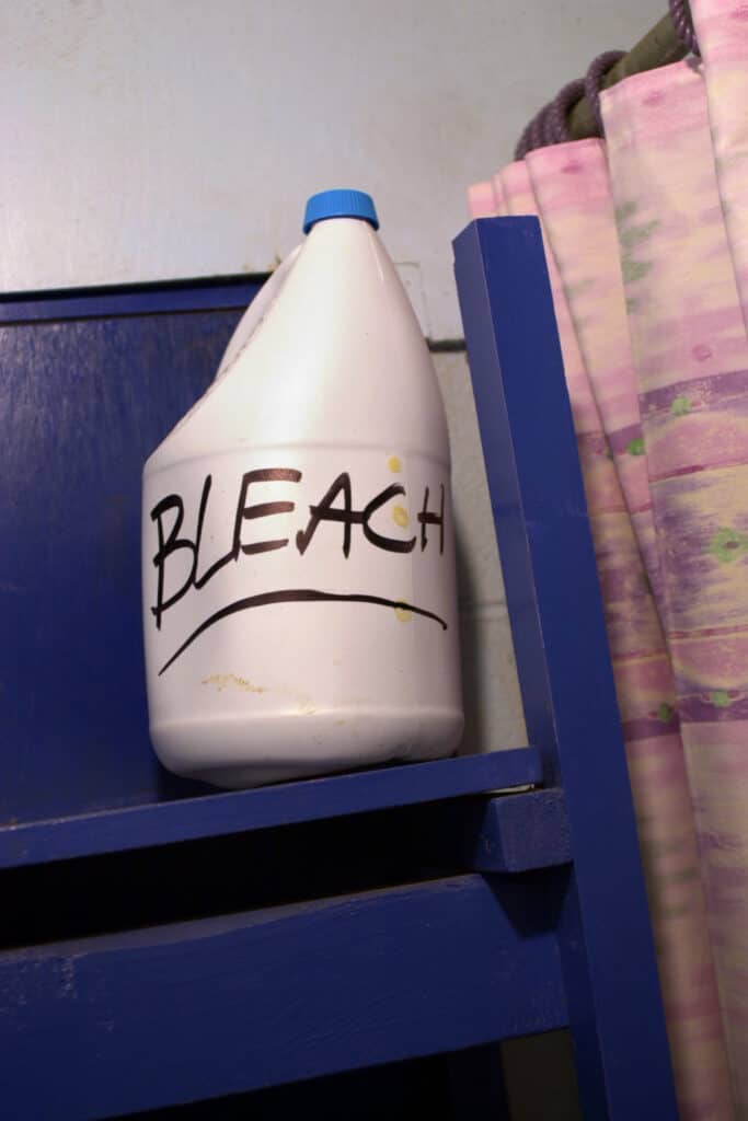Bottle of bleach to be used to clean coffee maker