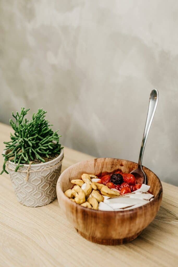 Fruit salad placed on a wooden bowl