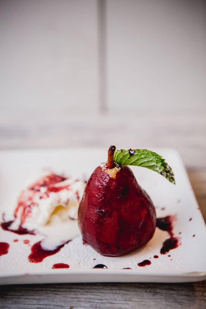 Poached pear with mulled wine and ice cream