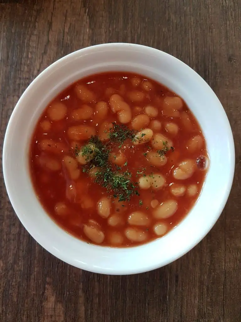 Baked beans in a white bowl