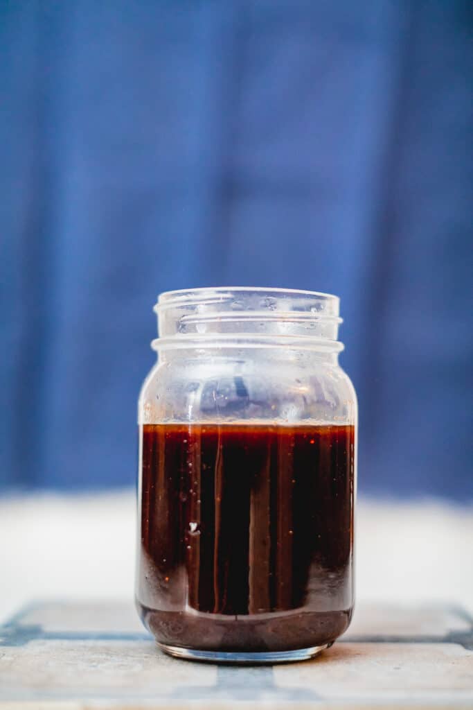 Homemade cranberry bbq sauce in a mason jar