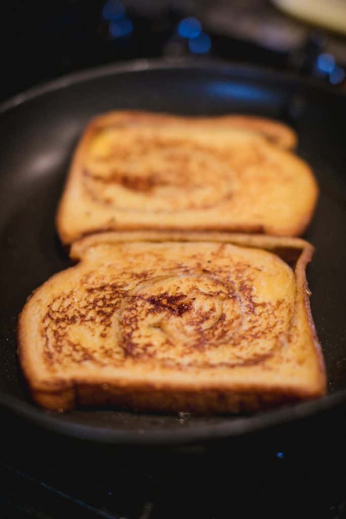 Bread being toasted in a skillet