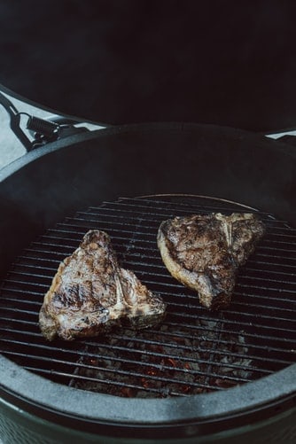 T-bone steaks being cooked on the grill