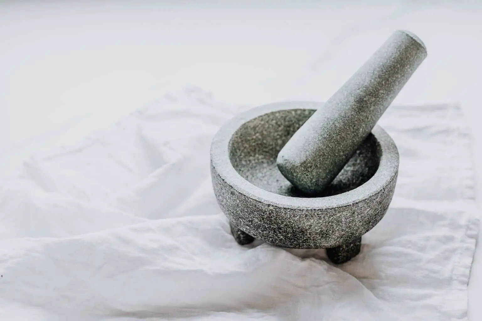 Mortar and pestle on white cloth