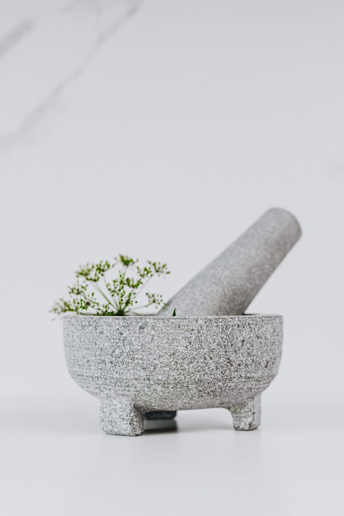 mortar and pestle with herbs