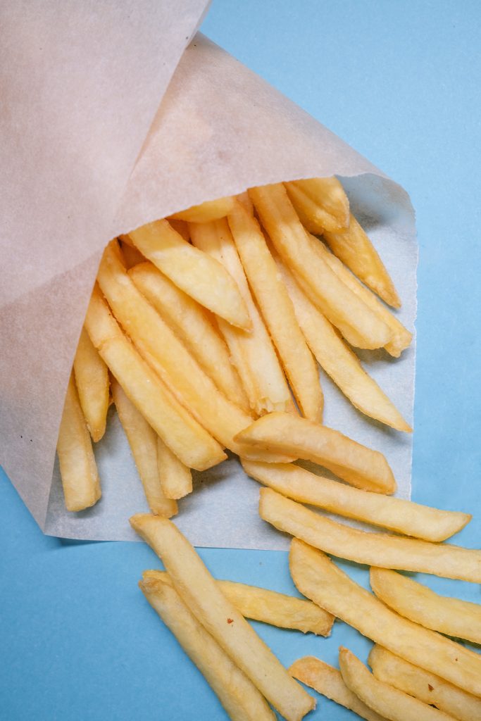 French fries wrapped in paper wax