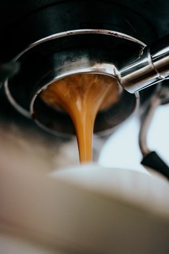 Fresh coffee coming out of an espresso machine
