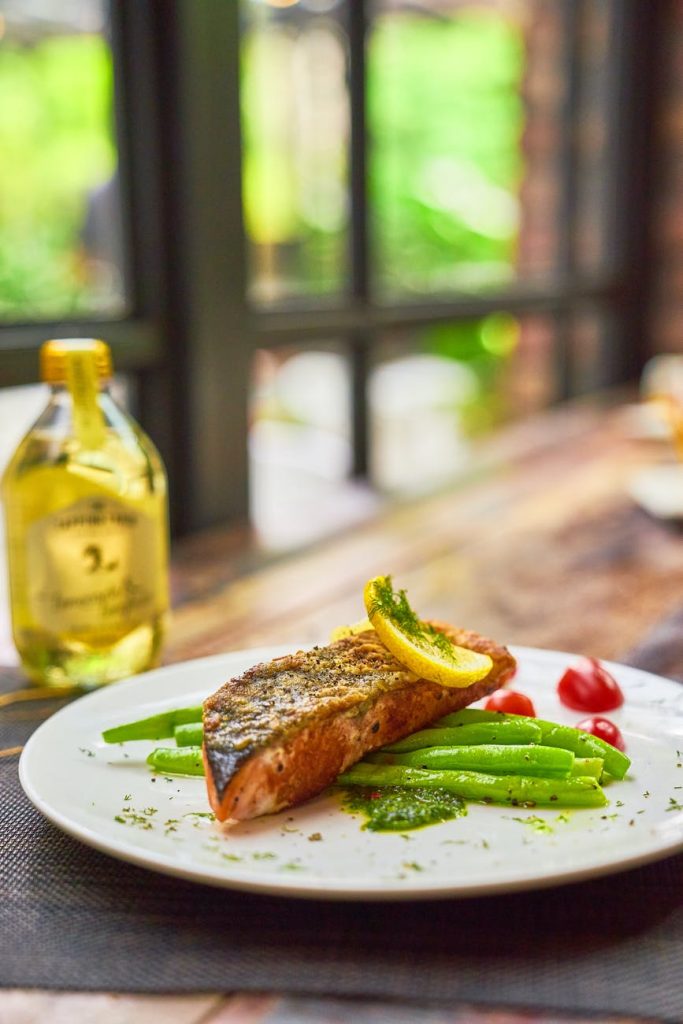 Pan fried salmon on top of asparagus