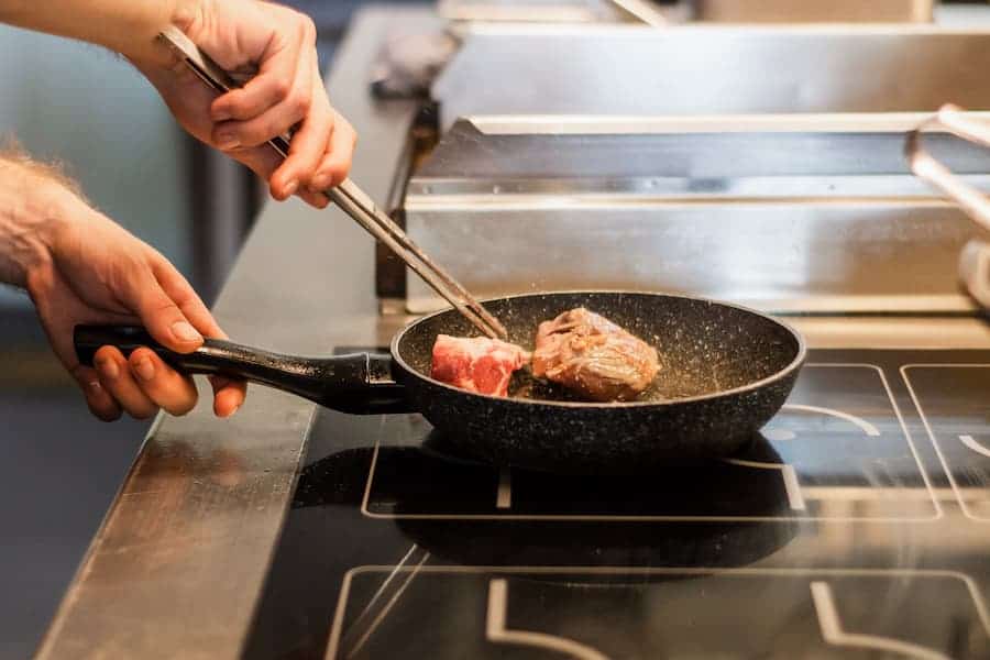 Pork cooking on a cast iron pan