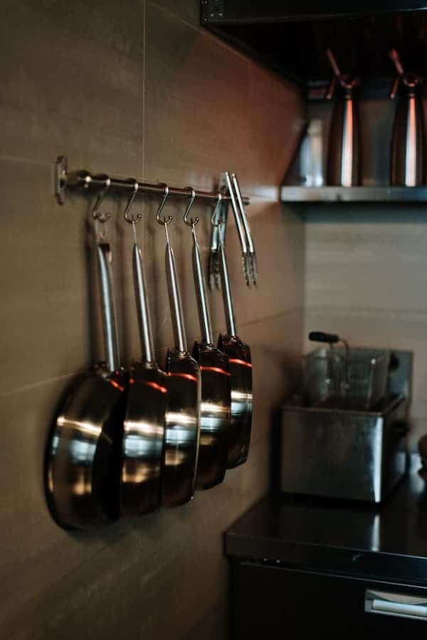 Set of stainless steel pans hanging