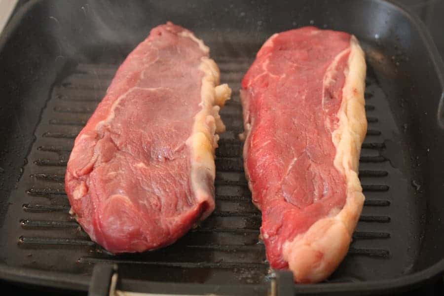 Pork cooking on a roasting pan