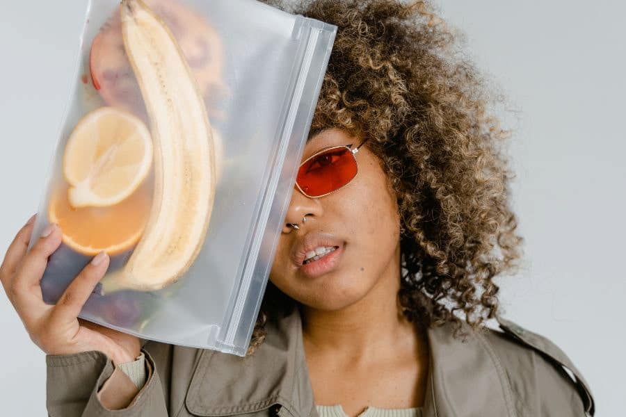 An image of a girl holding a silicone bag near her face